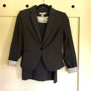 H&M grey fitted skirt suit. Size 4 jacket size 6 skirt.